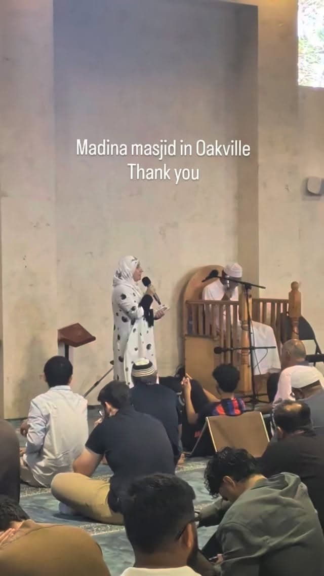 Zena Al-Mudaris speaking to a seated congregation inside Madina Masjid in Oakville