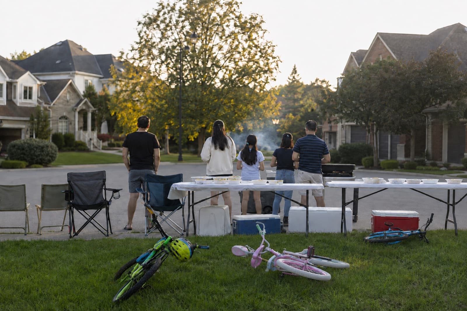 AI-generated illustration: neighbours gathered for a street barbecue on a suburban Oakville cul-de-sac