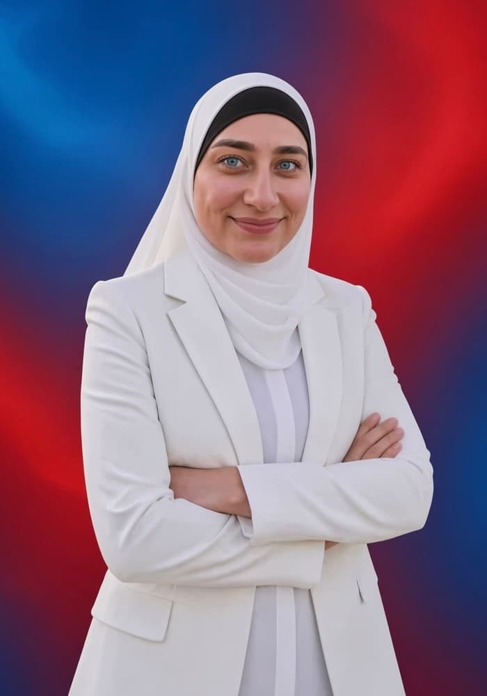 Zena Al-Mudaris in a white suit and hijab